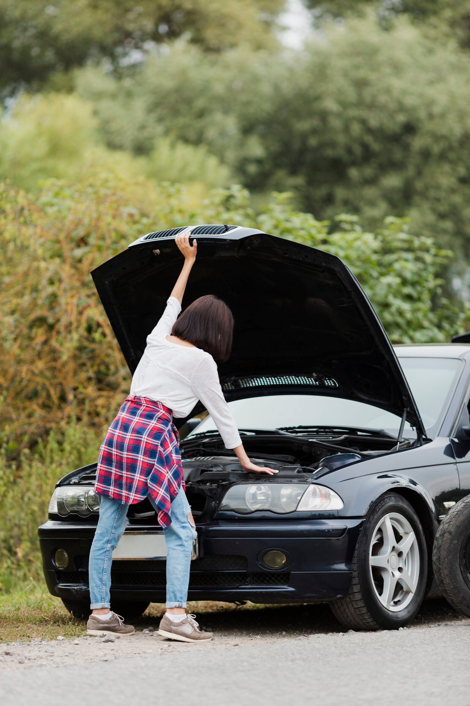 back-view-woman-checking-engine back-view-woman-checking-engine